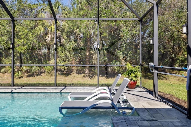 pool with a patio and a lanai