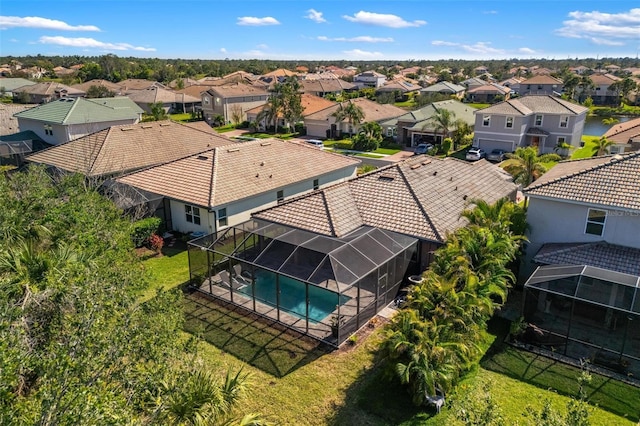 birds eye view of property with a residential view