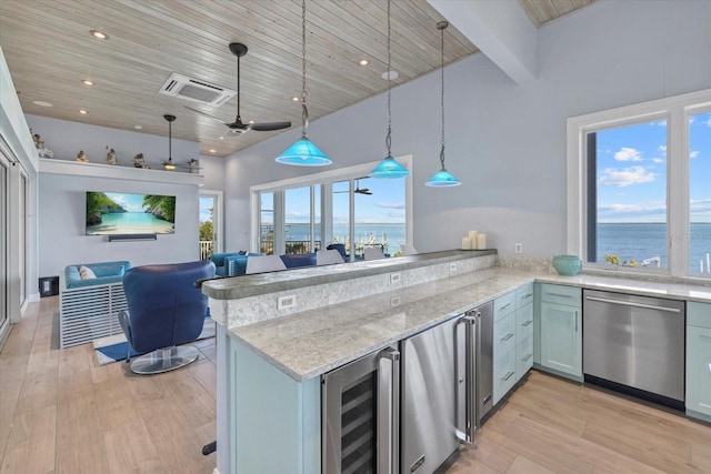 kitchen featuring wine cooler, a peninsula, light wood-style floors, open floor plan, and dishwasher