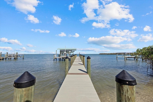 view of dock with a water view and boat lift