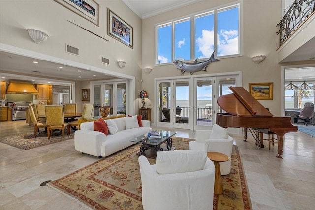 living area with plenty of natural light, visible vents, crown molding, and french doors