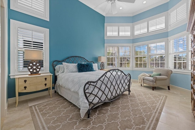 bedroom featuring ornamental molding, a high ceiling, baseboards, and tile patterned floors