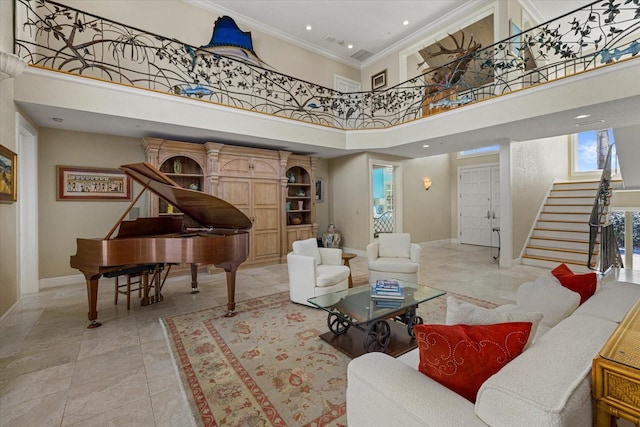 living area featuring a towering ceiling, stairs, baseboards, and ornamental molding