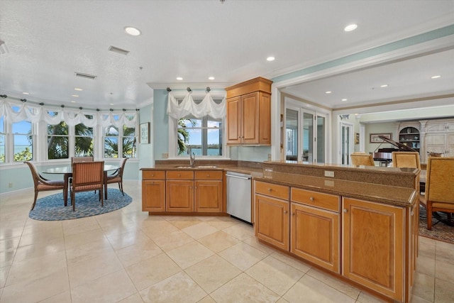 kitchen with dishwasher, a peninsula, ornamental molding, and brown cabinets