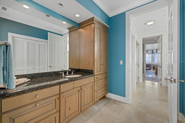 bathroom featuring recessed lighting, visible vents, ornamental molding, vanity, and baseboards