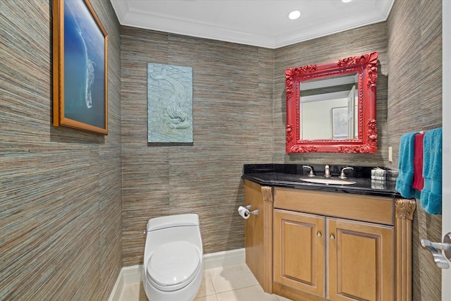 half bath with toilet, ornamental molding, vanity, tile patterned flooring, and baseboards