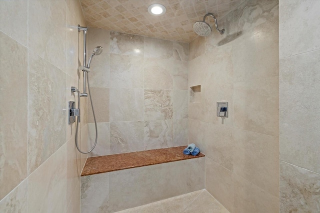 bathroom featuring a tile shower