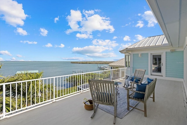 balcony featuring a water view