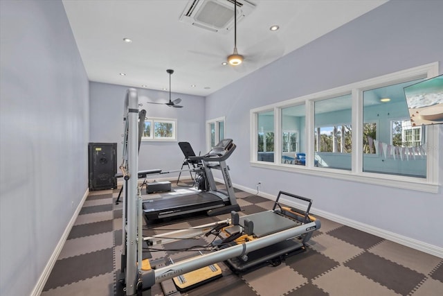 exercise area with baseboards and recessed lighting