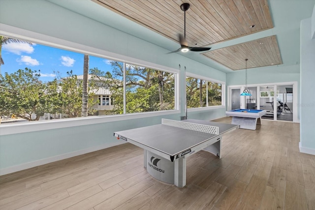 playroom featuring wood ceiling, baseboards, ceiling fan, and wood finished floors