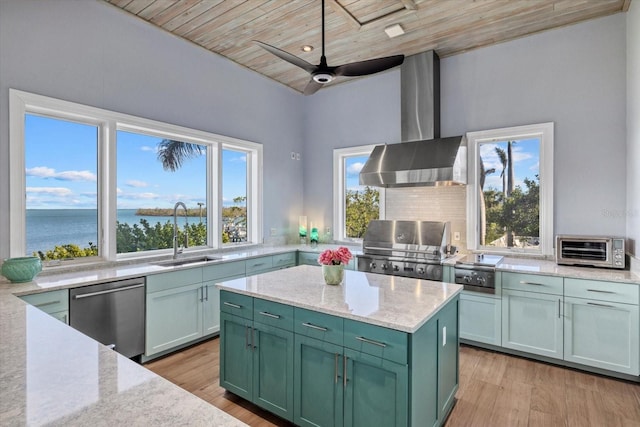 kitchen with wood ceiling, wall chimney exhaust hood, a sink, green cabinets, and stainless steel dishwasher