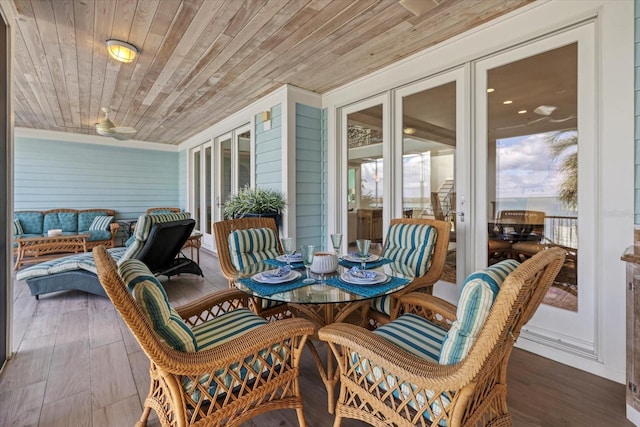 sunroom / solarium featuring wood ceiling