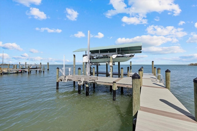 view of dock with a water view and boat lift