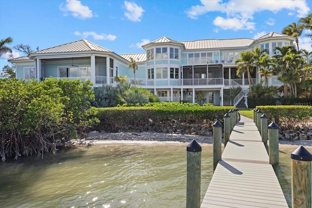 view of dock with stairway and a water view