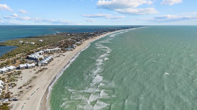 aerial view featuring a water view and a view of the beach