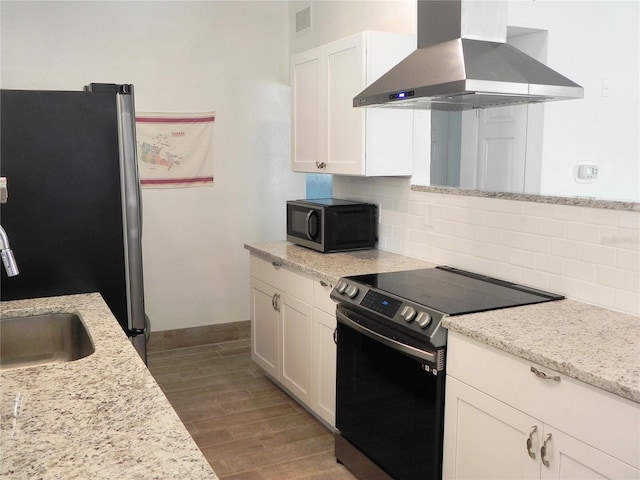 231 Redwood Rd, Venice, FL 34293 - kitchen with stainless steel appliances, dark wood-style flooring, a sink, exhaust hood, and decorative backsplash
