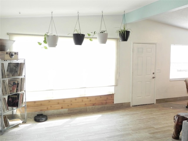 231 Redwood Rd, Venice, FL 34293 - interior space featuring vaulted ceiling, wood finished floors, and baseboards