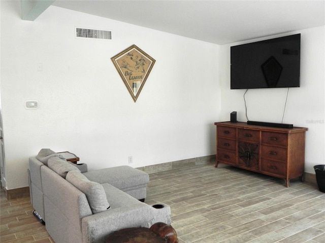 231 Redwood Rd, Venice, FL 34293 - living area featuring baseboards, visible vents, and wood finish floors
