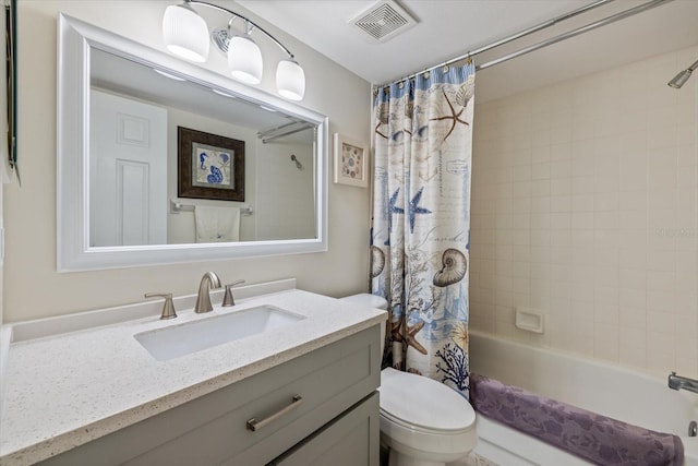 full bathroom featuring toilet, visible vents, shower / tub combo with curtain, and vanity