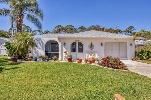 ranch-style house featuring a garage, concrete driveway, a front lawn, and stucco siding