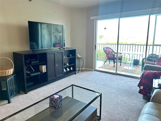 living room with light carpet and baseboards