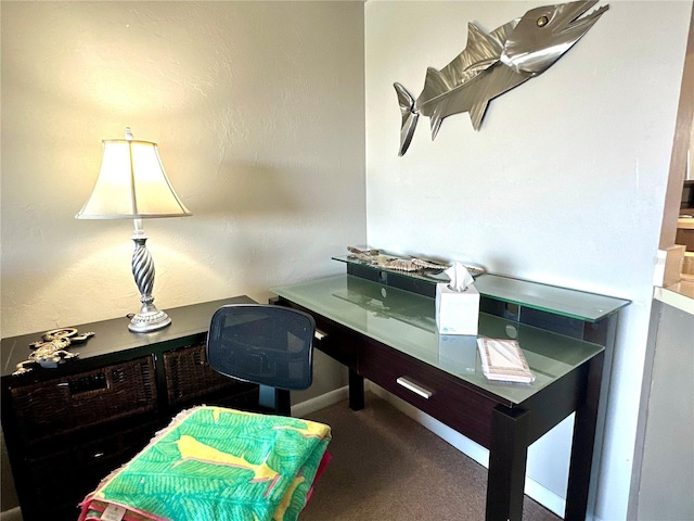 carpeted office featuring baseboards