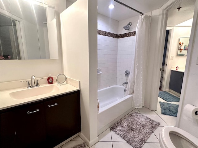 full bath featuring shower / bathtub combination with curtain, vanity, baseboards, and tile patterned floors