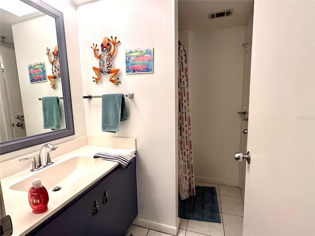 full bath with a shower with shower curtain, vanity, visible vents, and tile patterned floors