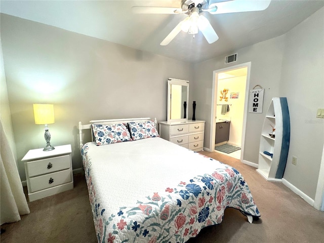 bedroom with connected bathroom, light colored carpet, a ceiling fan, baseboards, and visible vents