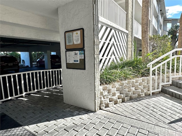 entrance to property with stucco siding