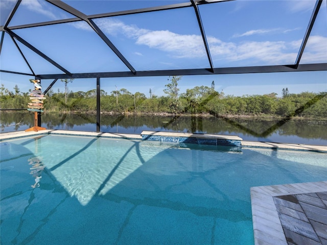 outdoor pool with a water view and glass enclosure