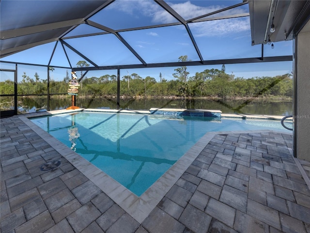 outdoor pool featuring a lanai and a patio area