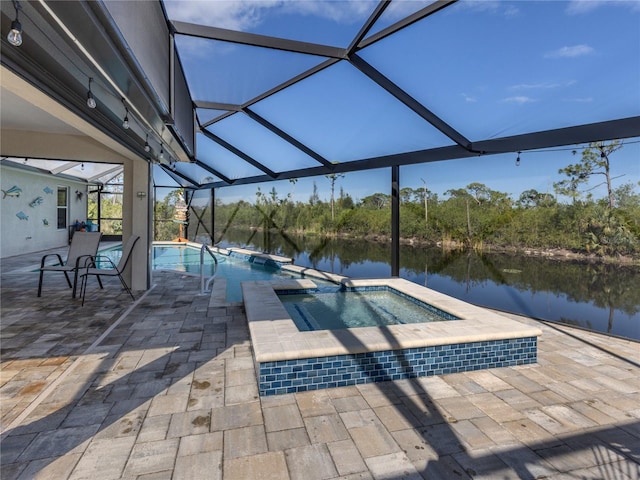 view of pool with a patio, a pool with connected hot tub, a water view, and glass enclosure