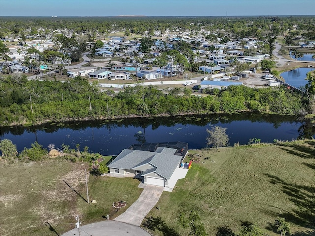 drone / aerial view with a water view and a residential view