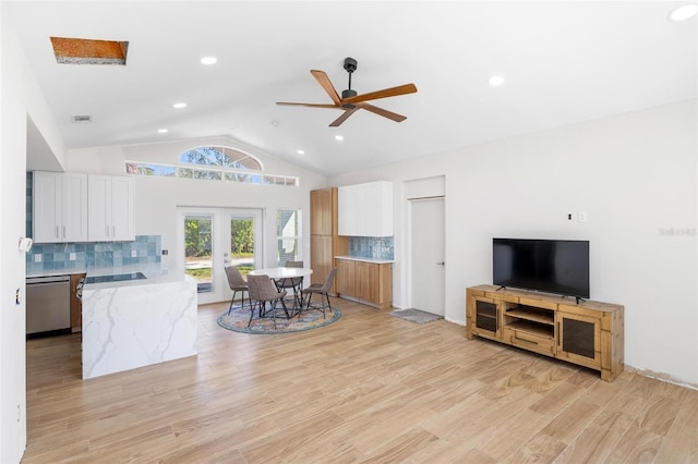 kitchen with french doors, white cabinetry, dishwasher, and light wood finished floors