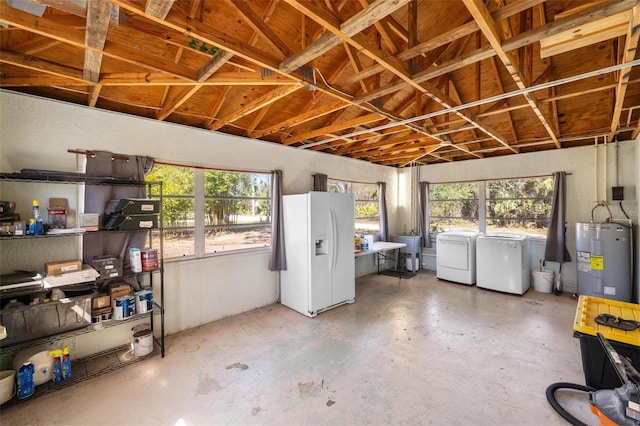 interior space featuring water heater, refrigerator, white fridge with ice dispenser, and independent washer and dryer