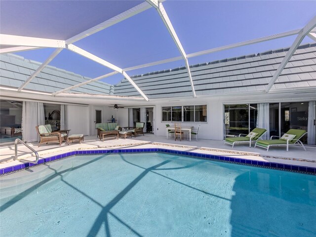 601 Apalachicola Rd, Venice, FL 34285 - swimming pool featuring ceiling fan, a patio, glass enclosure, outdoor dining area, and an outdoor living space