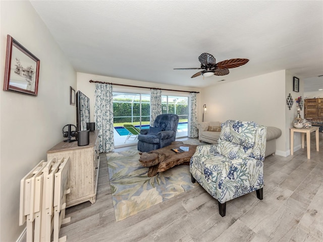 601 Apalachicola Rd, Venice, FL 34285 - living area featuring light wood-style floors and a ceiling fan