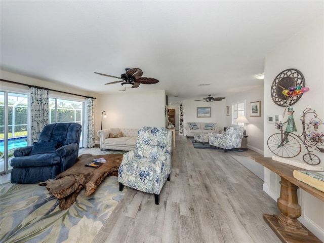 601 Apalachicola Rd, Venice, FL 34285 - living area featuring light wood-type flooring, ceiling fan, and baseboards