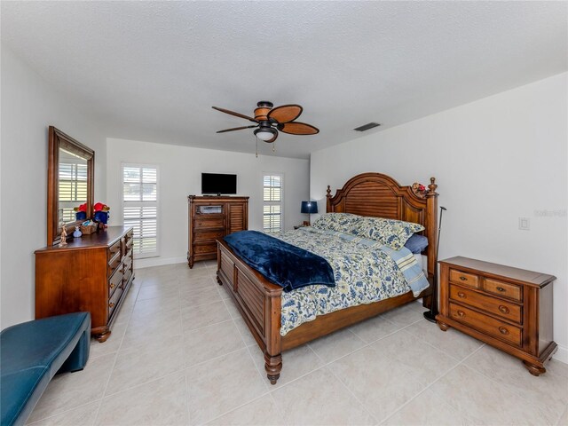 601 Apalachicola Rd, Venice, FL 34285 - bedroom with light tile patterned flooring, a ceiling fan, and baseboards