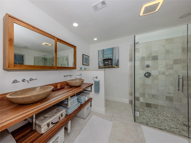 601 Apalachicola Rd, Venice, FL 34285 - full bath with a stall shower, recessed lighting, tile patterned flooring, baseboards, and double vanity