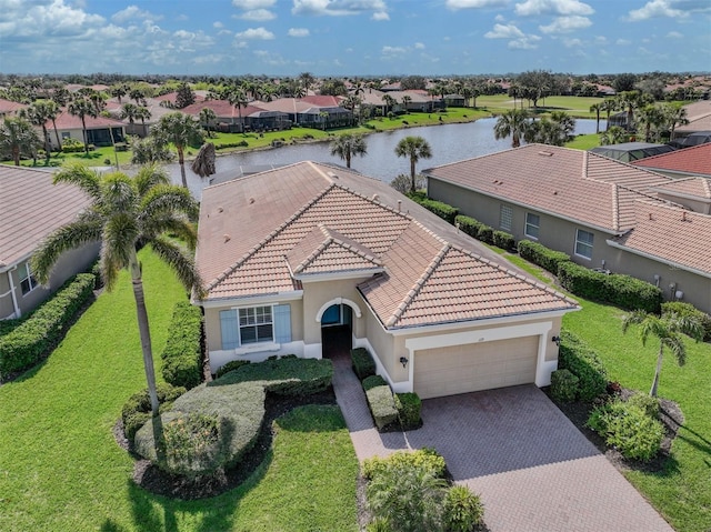 aerial view with a water view and a residential view