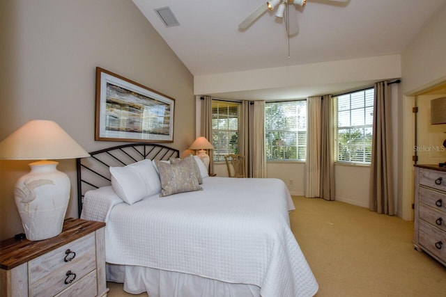 bedroom featuring lofted ceiling, visible vents, light carpet, ceiling fan, and baseboards