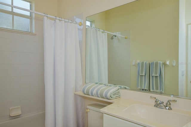 full bath with shower / tub combo and vanity