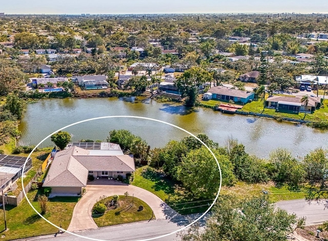 drone / aerial view with a water view and a residential view