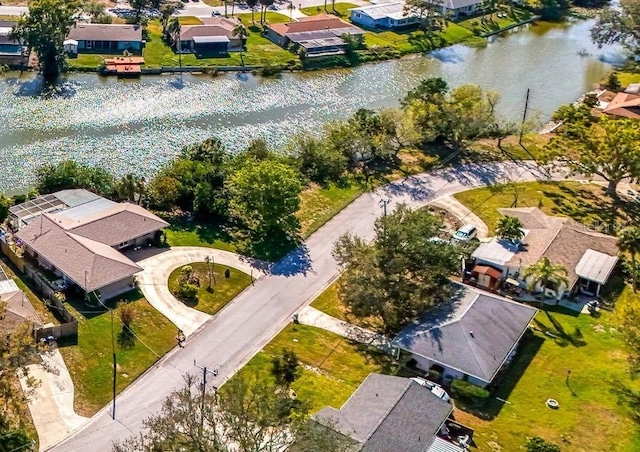 bird's eye view with a water view and a residential view