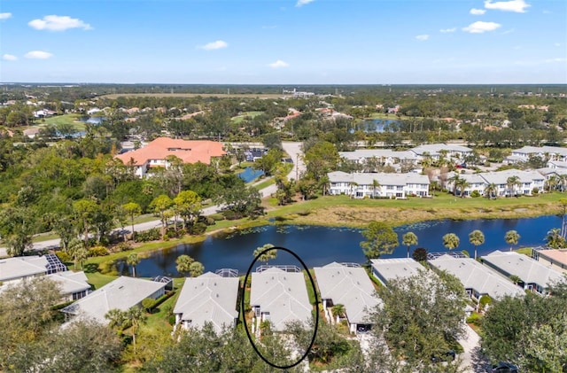 birds eye view of property featuring a residential view and a water view