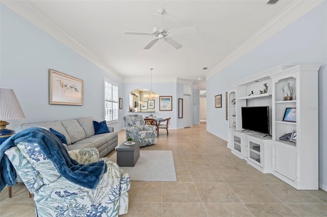 living area featuring light tile patterned flooring, crown molding, baseboards, and ceiling fan with notable chandelier