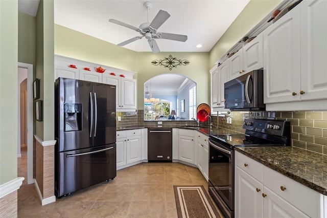 kitchen with electric range, white cabinetry, a sink, dishwashing machine, and black fridge