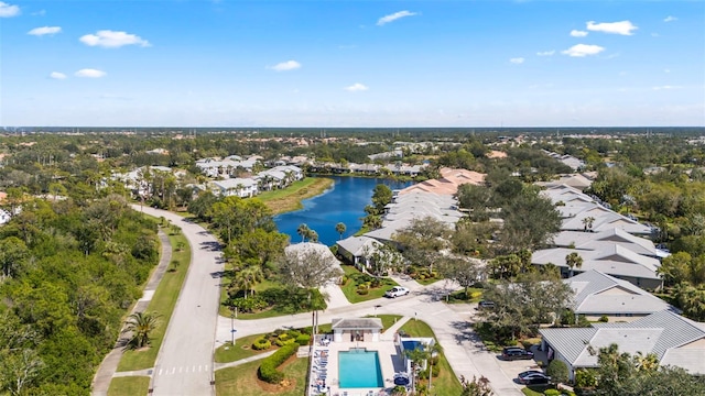 drone / aerial view with a water view and a residential view